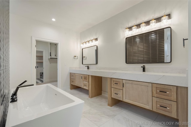 bathroom featuring double vanity, marble finish floor, a washtub, a sink, and recessed lighting