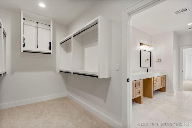 walk in closet with visible vents