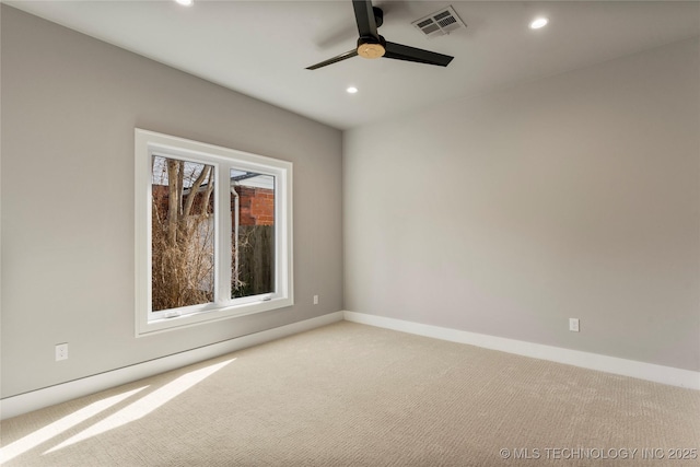 carpeted empty room with a ceiling fan, recessed lighting, visible vents, and baseboards