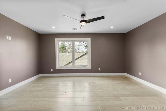 empty room featuring recessed lighting, ceiling fan, light wood finished floors, and baseboards