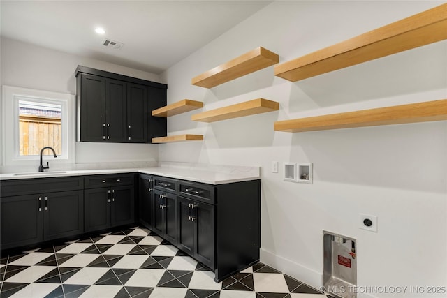 laundry area with washer hookup, visible vents, cabinet space, hookup for an electric dryer, and a sink