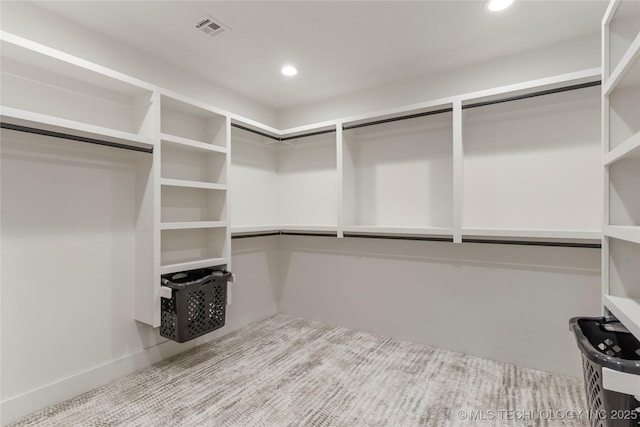 spacious closet featuring visible vents