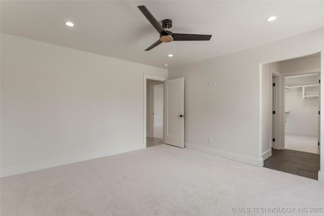 unfurnished bedroom with baseboards, carpet, and recessed lighting