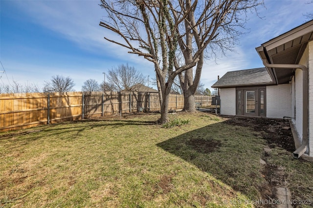 view of yard with a fenced backyard