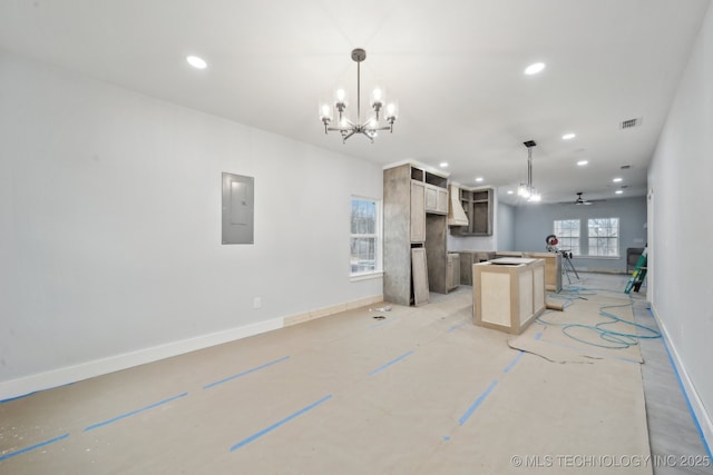 kitchen featuring electric panel, open floor plan, recessed lighting, and visible vents