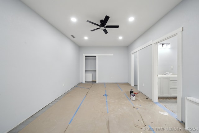 unfurnished bedroom with recessed lighting, visible vents, connected bathroom, and a ceiling fan