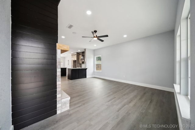 7890 N Oak Dr, Beggs, OK 74421 - unfurnished living room featuring ceiling fan, recessed lighting, visible vents, and wood finished floors