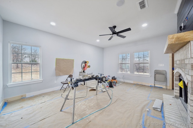 playroom with recessed lighting, visible vents, plenty of natural light, and a fireplace