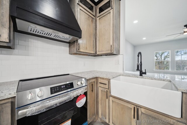 7890 N Oak Dr, Beggs, OK 74421 - kitchen featuring a ceiling fan, under cabinet range hood, stainless steel electric range oven, a sink, and backsplash