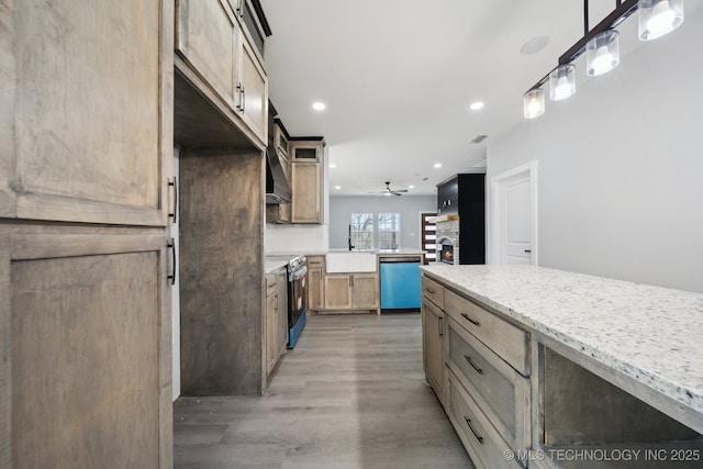 7890 N Oak Dr, Beggs, OK 74421 - kitchen with a peninsula, dishwashing machine, light wood-style flooring, a ceiling fan, and range with electric cooktop