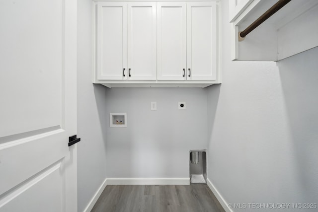 7890 N Oak Dr, Beggs, OK 74421 - washroom with baseboards, hookup for a washing machine, dark wood finished floors, cabinet space, and electric dryer hookup
