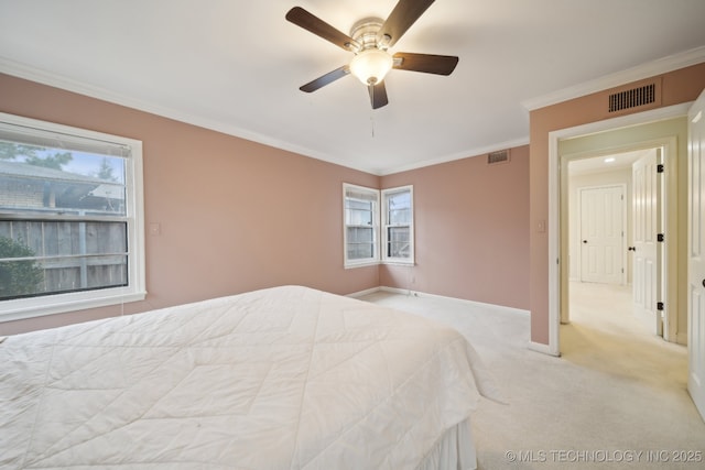 bedroom with ornamental molding, multiple windows, and visible vents