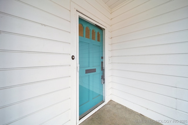 doorway to property featuring a garage