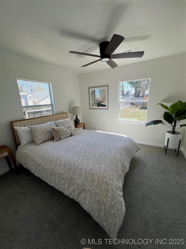 bedroom featuring carpet flooring, a ceiling fan, and baseboards