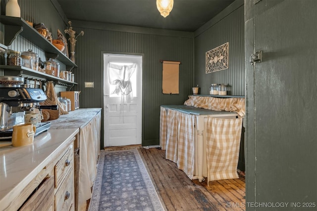 interior space featuring dark wood-style floors and open shelves