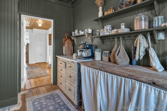 kitchen featuring wood-type flooring and open shelves