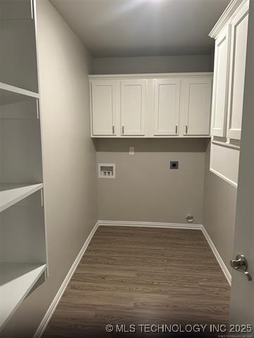 720 Elm St, Seminole, OK 74868 - washroom with dark wood-style flooring, electric dryer hookup, baseboards, and washer hookup