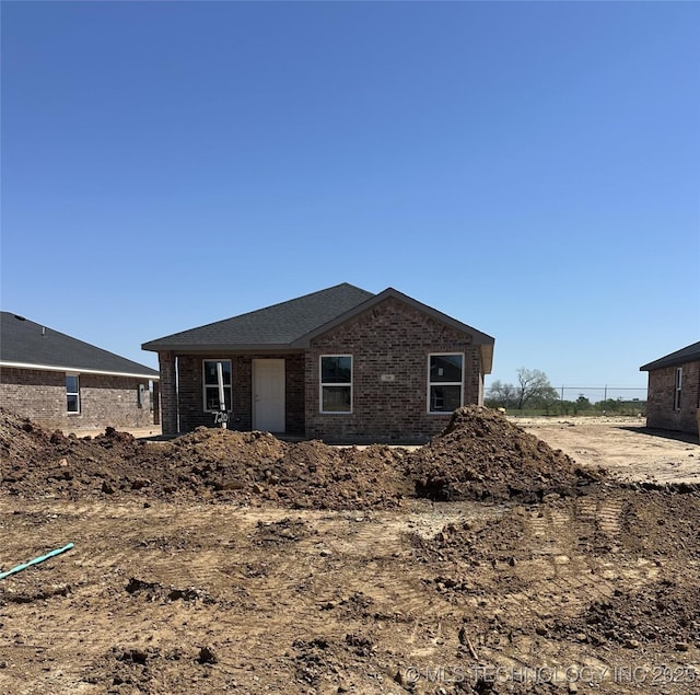 720 Elm St, Seminole, OK 74868 - rear view of property with brick siding