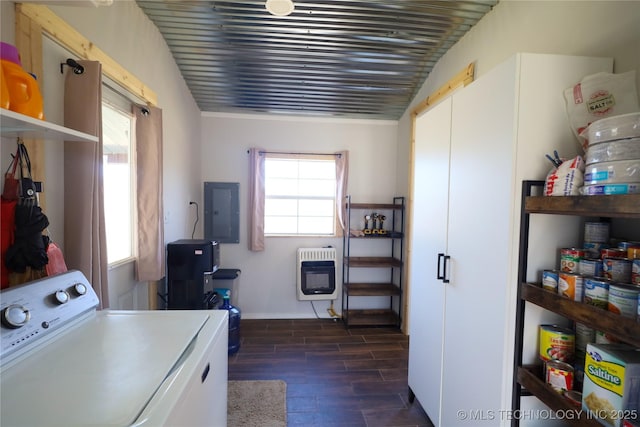 clothes washing area with heating unit, wood tiled floor, laundry area, electric panel, and washer / clothes dryer