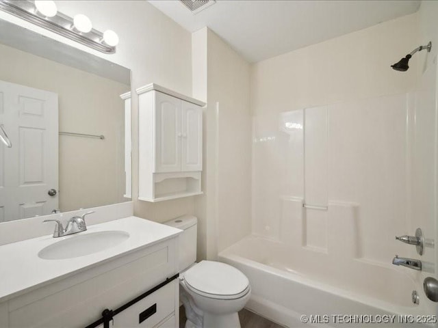 full bath featuring toilet, washtub / shower combination, visible vents, and vanity