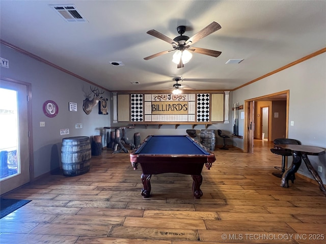 recreation room featuring billiards, crown molding, visible vents, and wood finished floors