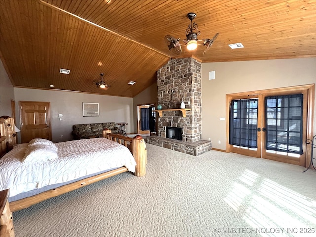 carpeted bedroom with visible vents, lofted ceiling, wooden ceiling, access to exterior, and a stone fireplace