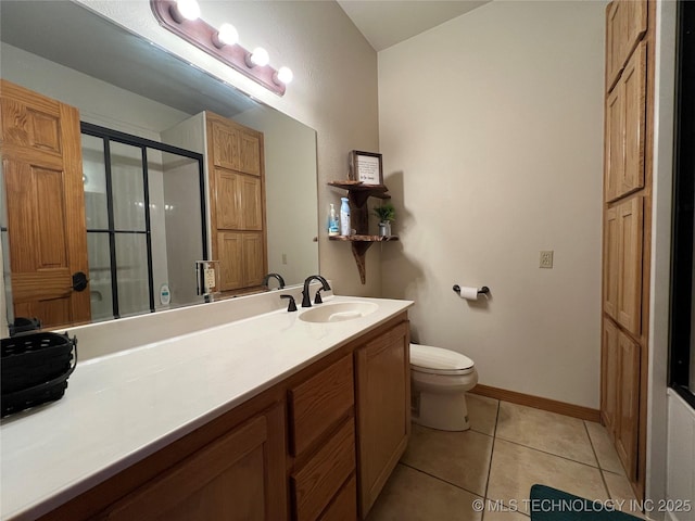 full bath featuring toilet, a shower with shower door, vanity, tile patterned flooring, and baseboards