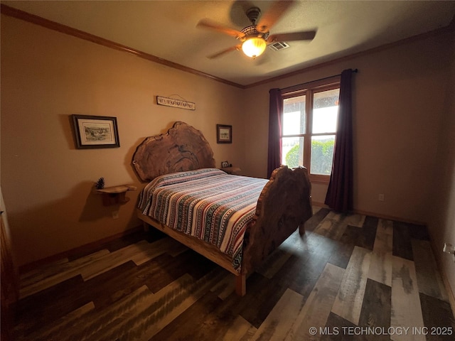 bedroom with a ceiling fan, wood finished floors, visible vents, and crown molding