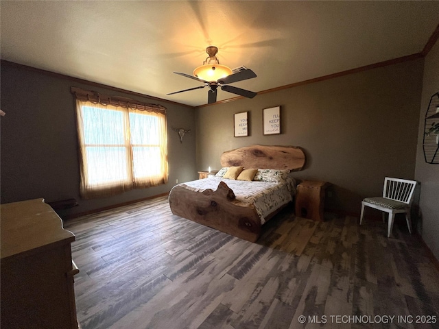 bedroom featuring ceiling fan, crown molding, and wood finished floors