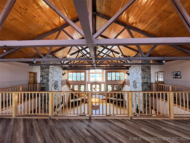 interior space with lofted ceiling with beams, wooden ceiling, wood finished floors, and an inviting chandelier