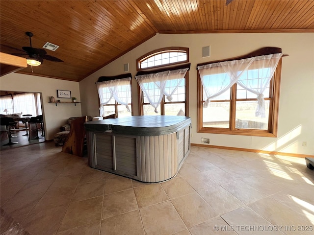 interior space with vaulted ceiling, wood ceiling, visible vents, and a healthy amount of sunlight