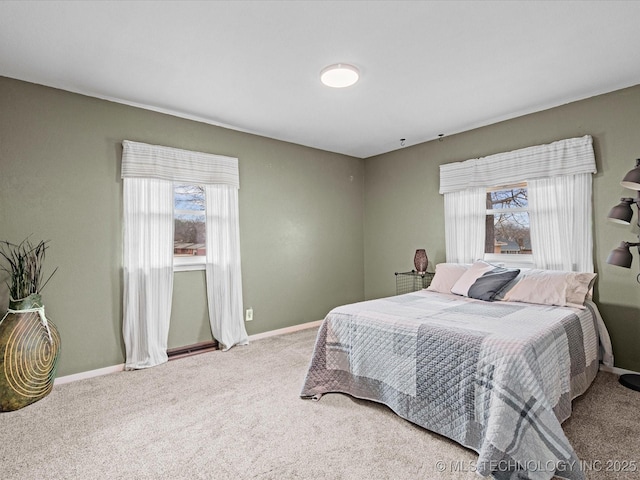 carpeted bedroom with baseboards