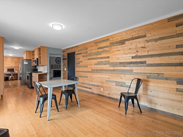 dining room with light wood-style flooring