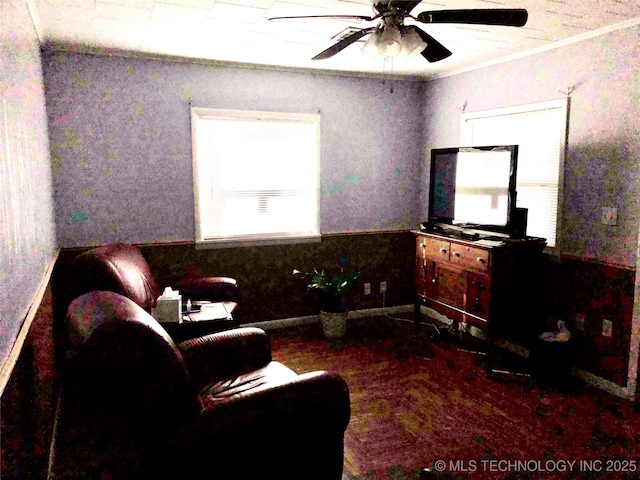 living area with ceiling fan and crown molding