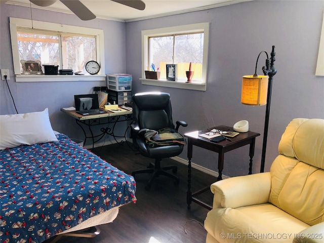 bedroom with ceiling fan, baseboards, and wood finished floors