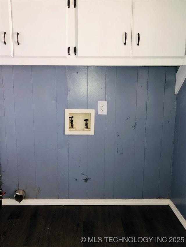 washroom featuring cabinet space, hookup for a washing machine, and dark wood-style flooring