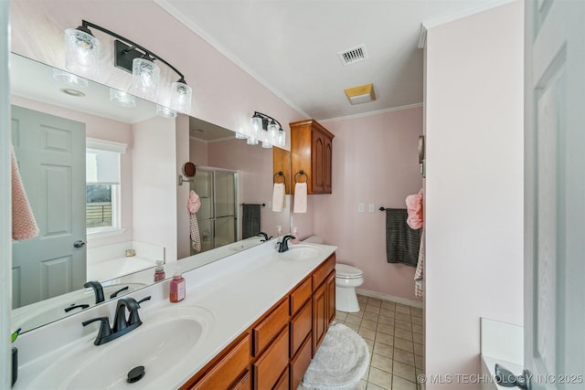 bathroom featuring visible vents, a sink, a shower stall, and a garden tub