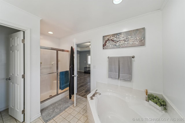 full bathroom featuring a garden tub, ornamental molding, a shower stall, and tile patterned floors