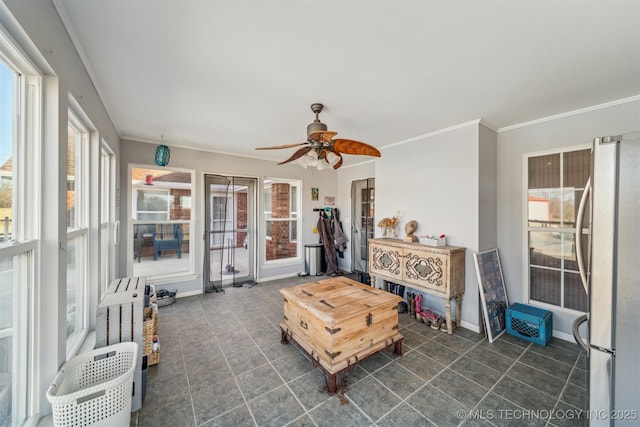 sunroom with ceiling fan