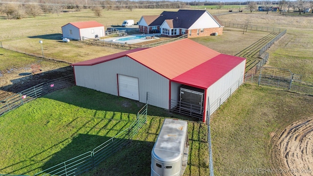 birds eye view of property featuring a rural view