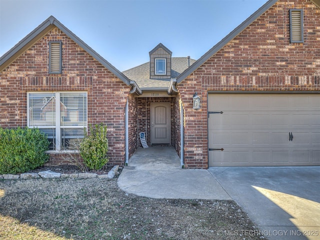 view of front of house with brick siding, concrete driveway, a garage, and a shingled roof