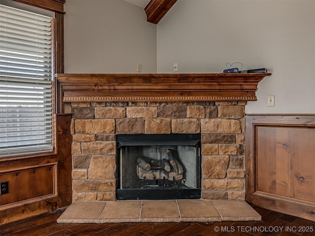 interior details with a fireplace and wood finished floors