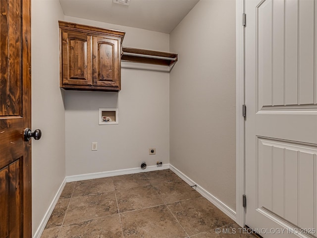 washroom with cabinet space, hookup for an electric dryer, baseboards, and washer hookup