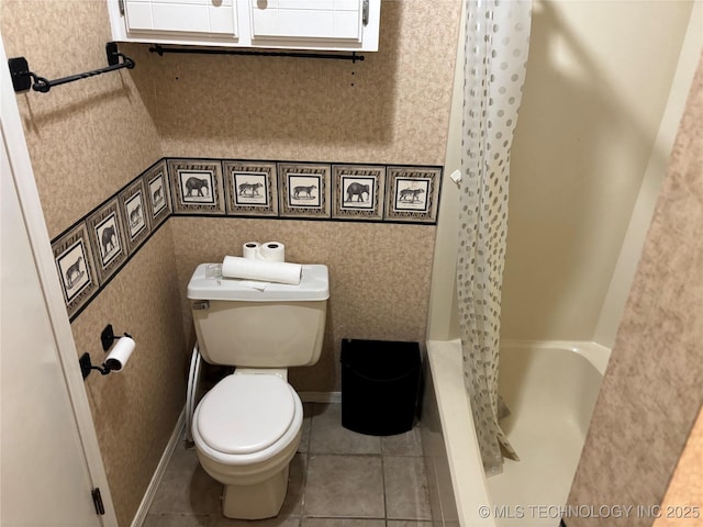 bathroom featuring wallpapered walls, tile patterned flooring, toilet, and baseboards