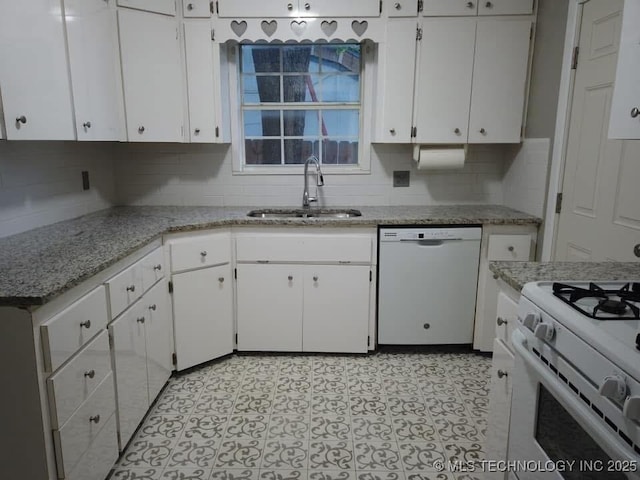 kitchen featuring white appliances, a sink, light stone countertops, white cabinetry, and backsplash