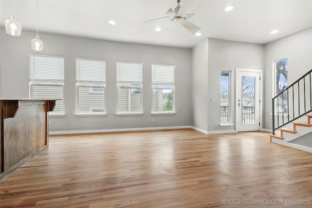 entryway featuring recessed lighting, light wood-style flooring, stairway, a ceiling fan, and baseboards