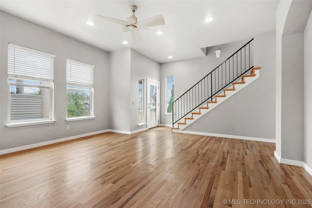 foyer with light wood finished floors, recessed lighting, stairway, a ceiling fan, and baseboards