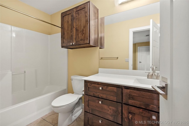 bathroom featuring vanity, shower / washtub combination, tile patterned flooring, and toilet