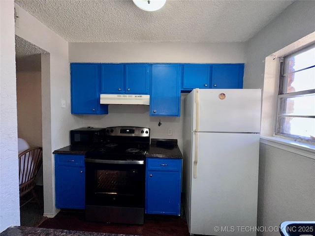 kitchen featuring blue cabinets, electric range, and freestanding refrigerator