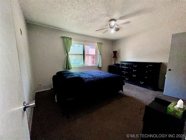 bedroom featuring a ceiling fan, carpet, and a textured ceiling